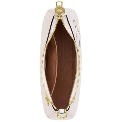 A top-down view of a light pink leather pouch with gold-tone hardware, showing a brown interior lining and a black zipper track, set against a plain white background.